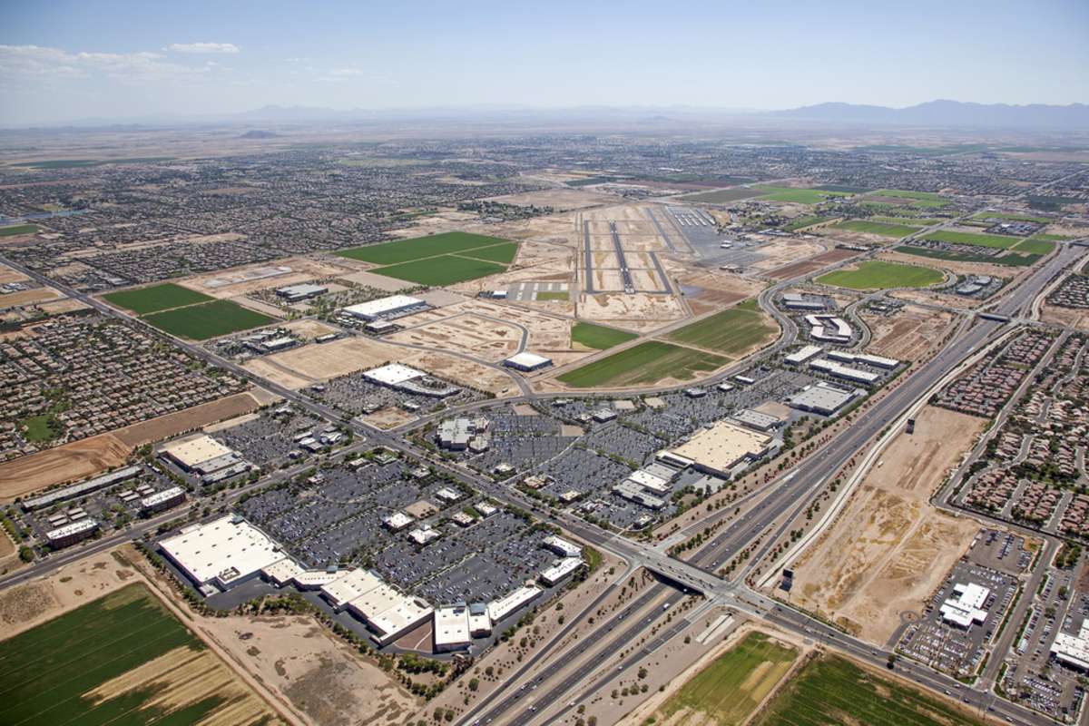 Chandler, Arizona Airport and the Loop 202 freeway with surrounding homes, retail, office and business development