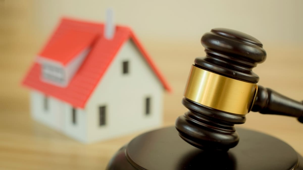Gavel and wooden house, real estate law agreements