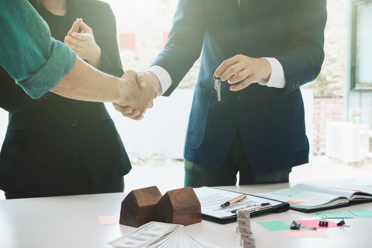 Business handshake after multifamily investment deal