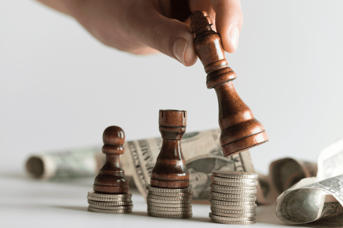 Chess pieces over dollar bills